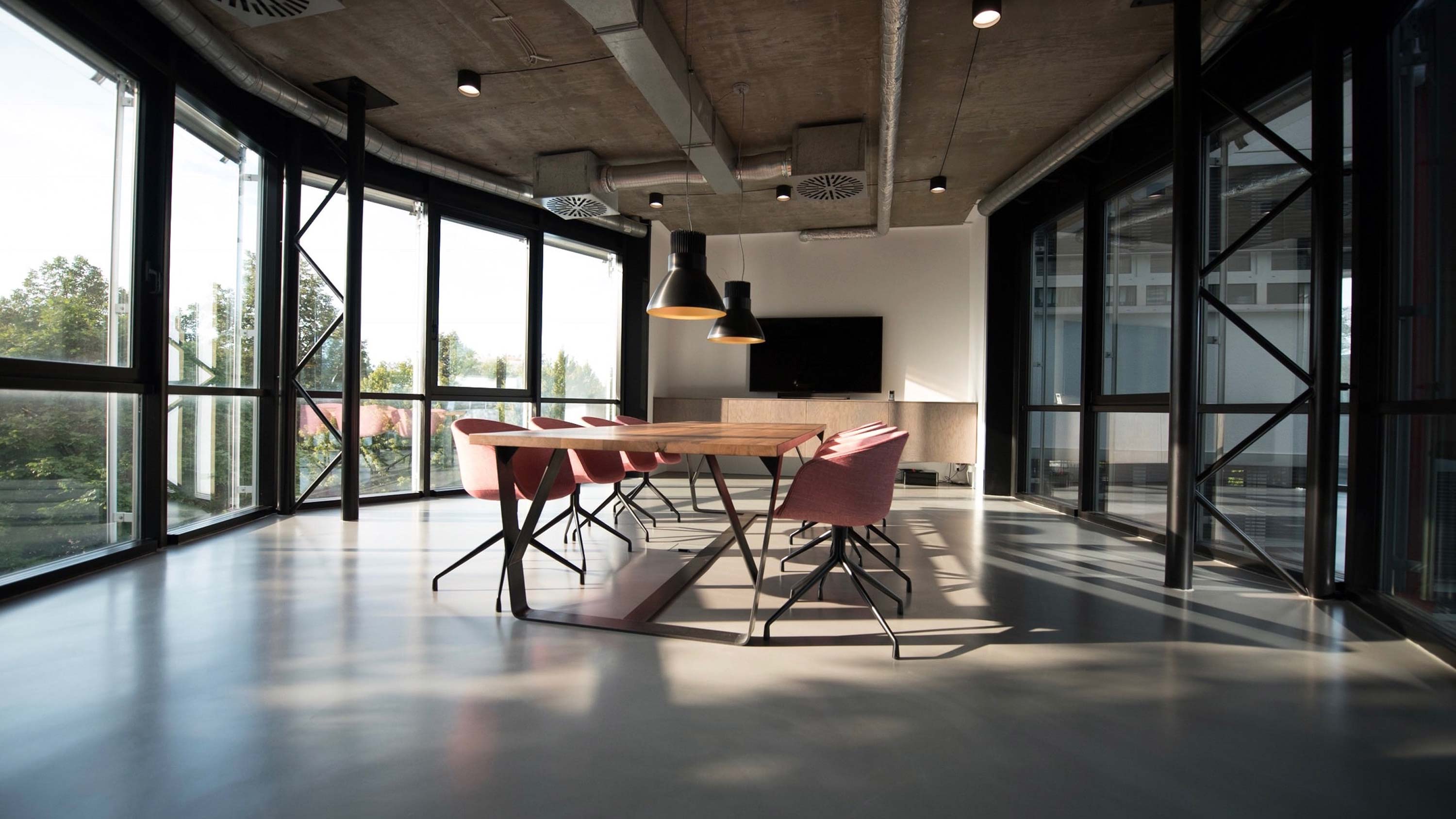 huddle room with pink chairs