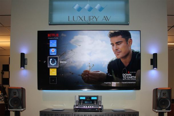 Close-up of Netflix menu on showroom TV under Luxury AV signage