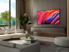 Modern living room with large TV mounted above floating cabinet
