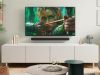 Cozy living space with wall-mounted TV and fantasy movie scene